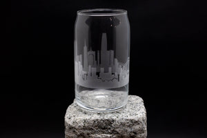 a glass sitting on top of a rock