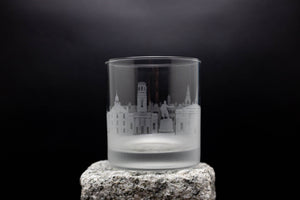 a glass with a picture of a city on it