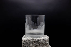 a glass sitting on top of a rock