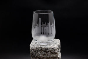 a glass sitting on top of a rock