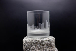 a glass sitting on top of a rock