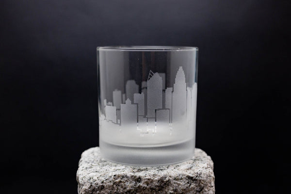 a glass sitting on top of a rock