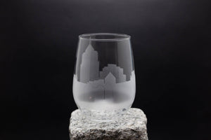 a glass sitting on top of a rock