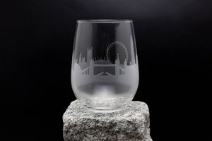 a glass sitting on top of a rock