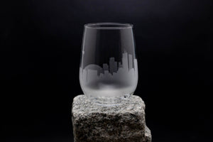 a glass sitting on top of a rock