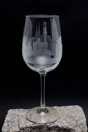 a wine glass sitting on top of a rock