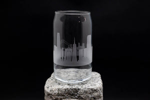 a glass with a city skyline etched on it