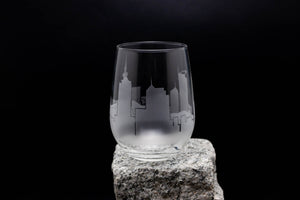 a glass sitting on top of a rock