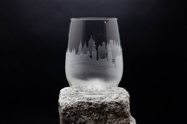 a glass sitting on top of a rock