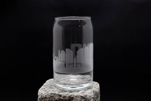 a glass with a city skyline etched on it