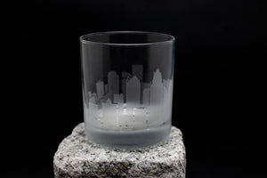 a glass sitting on top of a rock