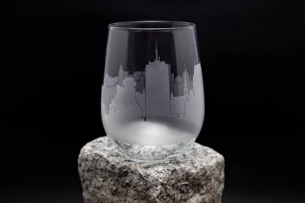 a glass sitting on top of a rock