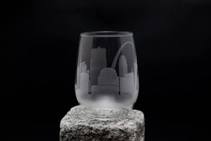 a glass sitting on top of a rock