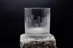 a glass sitting on top of a rock