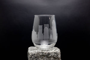 a glass sitting on top of a rock