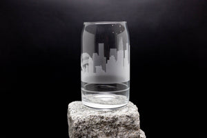 a glass sitting on top of a rock