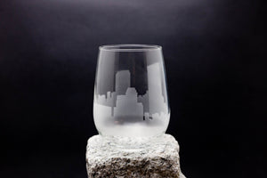 a glass sitting on top of a rock