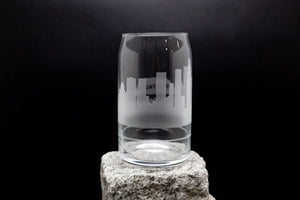 a glass sitting on top of a rock