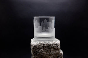 a glass sitting on top of a rock