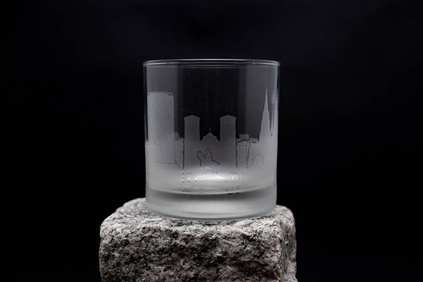 a glass sitting on top of a rock