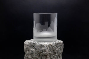 a glass sitting on top of a rock