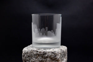 a glass sitting on top of a rock