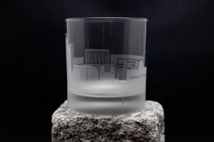 a shot glass sitting on top of a rock