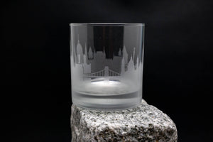 a glass sitting on top of a rock