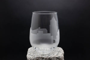 a glass sitting on top of a rock