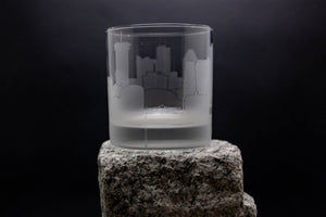 a glass sitting on top of a rock