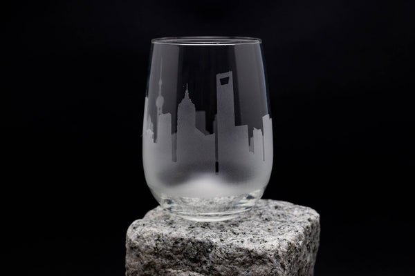 a glass sitting on top of a rock