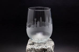 a glass sitting on top of a rock