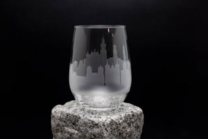 a glass sitting on top of a rock