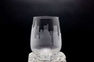 a glass sitting on top of a rock