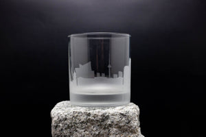 a glass sitting on top of a rock