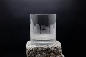 a glass sitting on top of a rock