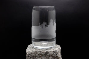 a glass sitting on top of a rock