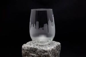 a glass sitting on top of a rock