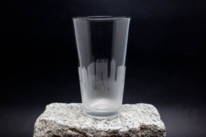 a glass sitting on top of a rock