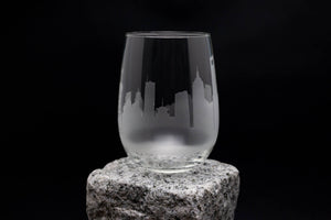 a glass sitting on top of a rock