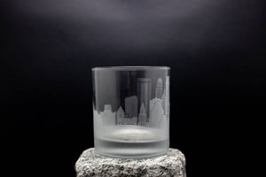 a glass sitting on top of a rock