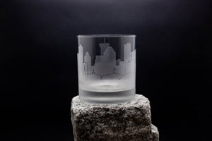 a glass sitting on top of a rock