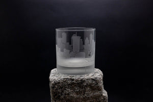 a glass sitting on top of a rock