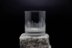 a glass sitting on top of a rock