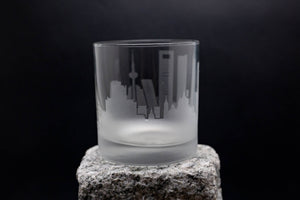 a glass sitting on top of a rock