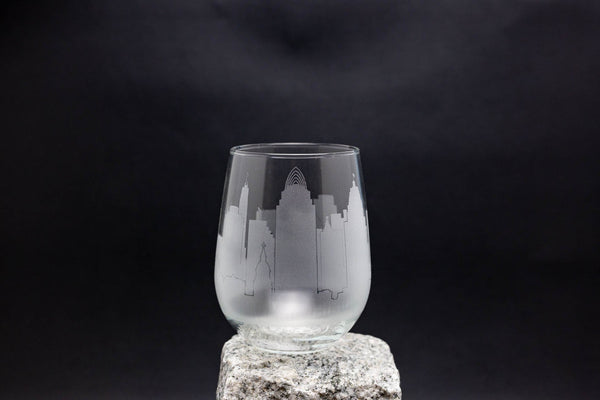 a glass sitting on top of a rock