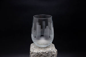 a glass sitting on top of a rock