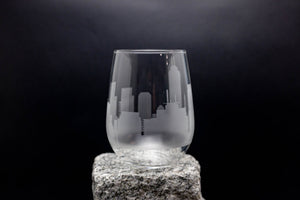 a glass sitting on top of a rock