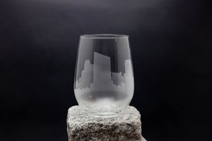 a glass sitting on top of a rock