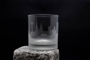 a glass sitting on top of a rock